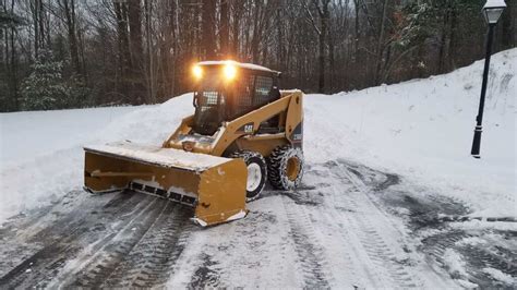 plowing snow with a track skid steer|best skid steer snow pusher.